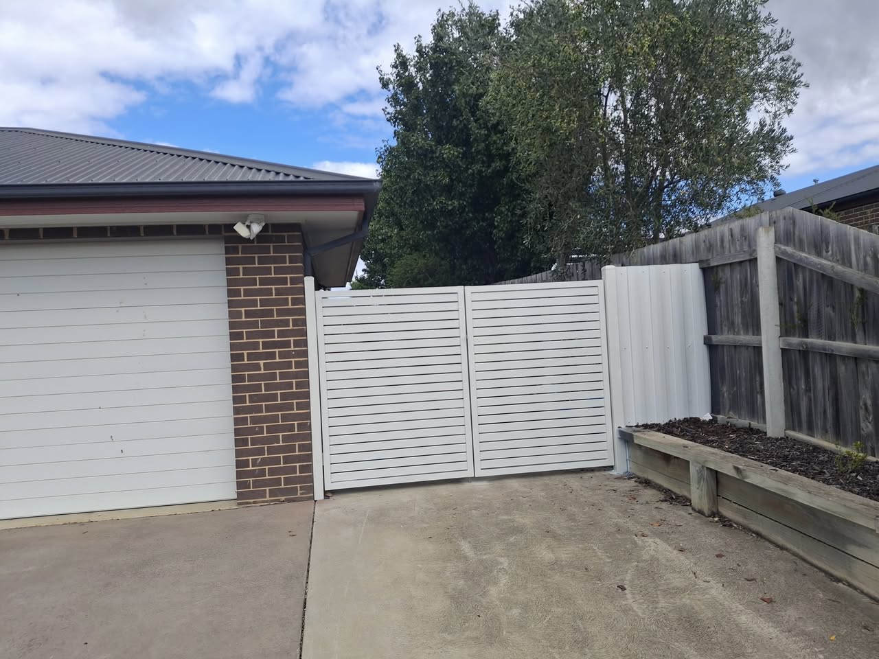 White slat gate installation
