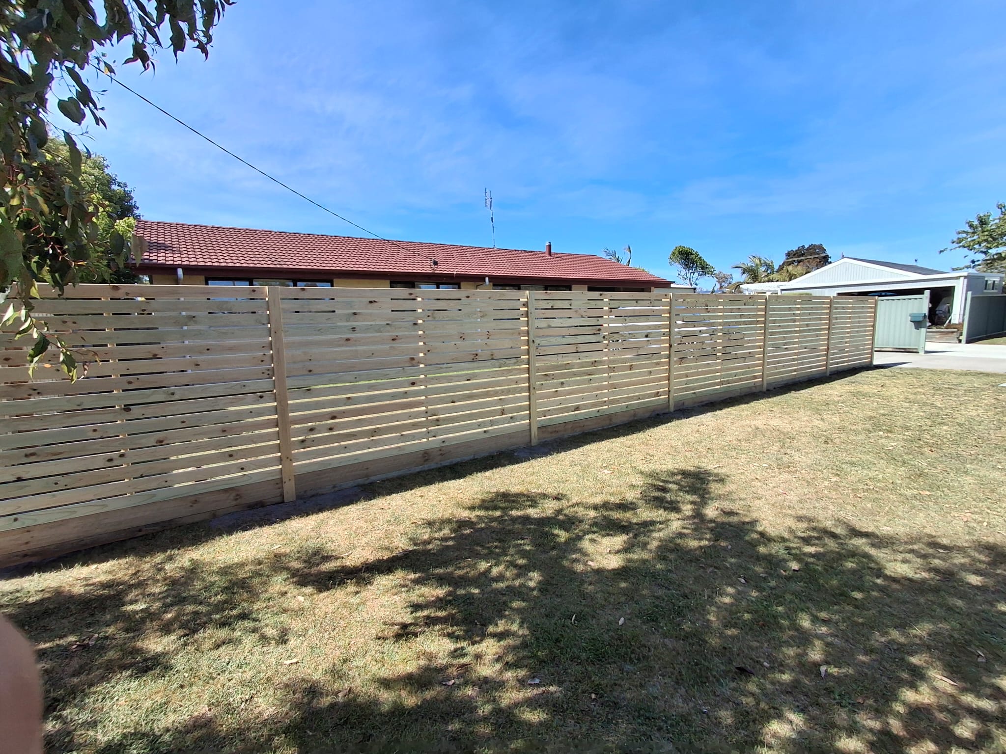 Horizontal slat fence front yard
